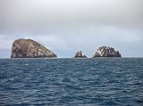 Galapagos 2-1-20 Gordon Rocks We got back on the Eden and sailed during lunch and afternoon to our next stop  Sante Fe. On the way I spotted three small islets called Gordons Rocks, a short distance north of the Plazas islands off the east coast of Santa Cruz. Roca Gordon is said to be one of the best dive sites around Santa Cruz.